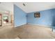 Spacious living room with light blue walls and carpeted floors at 10507 Goldwater Ln, Riverview, FL 33569