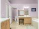 Main bathroom with a large soaking tub and double sinks at 10507 Goldwater Ln, Riverview, FL 33569