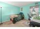 Small bedroom with a twin-size bed and desk area at 10507 Goldwater Ln, Riverview, FL 33569