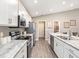 Modern kitchen with white cabinets and granite countertops at 2560 58Th E Cir, Palmetto, FL 34221