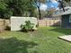 Backyard with storage shed and wooden fence at 6704 N 13Th St, Tampa, FL 33604