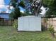 White shed in backyard with wooden fence at 6704 N 13Th St, Tampa, FL 33604