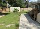 Backyard with patio, storage shed, and grassy area at 6704 N 13Th St, Tampa, FL 33604