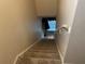 Carpeted staircase leading upstairs at 6704 N 13Th St, Tampa, FL 33604