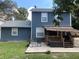 House exterior showcasing backyard patio and deck at 6704 N 13Th St, Tampa, FL 33604