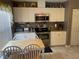 Kitchen with white cabinets and table at 6704 N 13Th St, Tampa, FL 33604