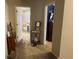 Hallway with carpet and access to bedrooms at 6704 N 13Th St, Tampa, FL 33604