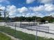 Sand volleyball court with fencing and lighting at 6704 N 13Th St, Tampa, FL 33604