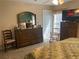 Main bedroom with king-size bed, dresser and rocking chairs at 6704 N 13Th St, Tampa, FL 33604
