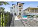 Private backyard oasis with a pool and lounge area, perfect for relaxation at 116 Wimbledon Ct, Redington Shores, FL 33708