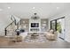 Spacious living room featuring a fireplace, large TV, and comfortable seating at 116 Wimbledon Ct, Redington Shores, FL 33708