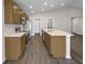 Modern kitchen with stainless steel appliances and an island at 35591 Bellington Blvd, Zephyrhills, FL 33541