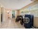 Large laundry room with tile floor, plenty of space for storage and washer/dryer hookups at 4414 E Sligh Ave, Tampa, FL 33610