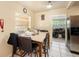 Casual dining area with a table and four chairs, adjacent to the kitchen at 4414 E Sligh Ave, Tampa, FL 33610