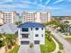 Modern two-story house with a metal roof, and two-car garage at 116 Wimbledon Ct, Redington Shores, FL 33708