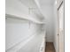 Bright and spacious pantry with white shelves and marble countertops at 116 Wimbledon Ct, Redington Shores, FL 33708