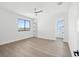 Bright and airy bedroom with hardwood floors and large windows at 116 Wimbledon Ct, Redington Shores, FL 33708