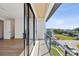 Private balcony with modern metal railing and wood ceiling at 116 Wimbledon Ct, Redington Shores, FL 33708