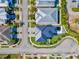 Modern home with a dark metal roof and a landscaped yard at 116 Wimbledon Ct, Redington Shores, FL 33708