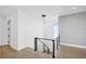 Elegant staircase with glass railings and modern light fixture at 116 Wimbledon Ct, Redington Shores, FL 33708