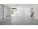 Extra large garage with finished flooring and open access at 116 Wimbledon Ct, Redington Shores, FL 33708