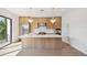 Modern kitchen with light wood cabinets and large island at 116 Wimbledon Ct, Redington Shores, FL 33708