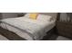 Main bedroom with king-size bed and gray nightstands at 16988 Oval Rum Dr, Wimauma, FL 33598