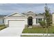 Single-Gathering home with stone accents at 16988 Oval Rum Dr, Wimauma, FL 33598