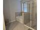 Bathroom with soaking tub and walk-in shower at 16988 Oval Rum Dr, Wimauma, FL 33598