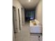 Entryway with tile flooring and a white couch at 16988 Oval Rum Dr, Wimauma, FL 33598