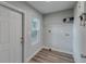 Laundry room with built-in shelving and exterior access at 1310 E Tomlin St, Plant City, FL 33563