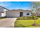 One-story house with attached garage and landscaping at 3808 Capri Coast Dr, Plant City, FL 33565