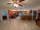 Open dining area with kitchen and tile flooring at 11616 E Boki Ln, Thonotosassa, FL 33592