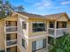 Tan two-story building with large windows and balconies at 1550 S Belcher Rd # 535, Clearwater, FL 33764