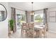 Bright dining area with sliding glass doors leading to patio at 7011 161St E Ter, Parrish, FL 34219