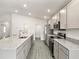 Modern kitchen boasting stainless steel appliances, granite countertops, and an abundance of cabinet storage at 7011 161St E Ter, Parrish, FL 34219