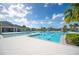 Large community pool with ample lounge chairs and a diving board at 7209 Sweet Alyssum Ct, Tampa, FL 33619