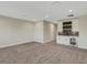 Large bonus room with wet bar and ample space for entertaining at 10469 Meadowrun Dr, Lithia, FL 33547