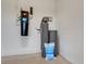 Garage with central vacuum system and water softener at 10469 Meadowrun Dr, Lithia, FL 33547