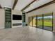 Living room with fireplace, built-in shelving, and herringbone floors at 10469 Meadowrun Dr, Lithia, FL 33547