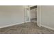 Open concept floor plan with herringbone floors and neutral tones at 10469 Meadowrun Dr, Lithia, FL 33547