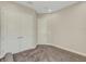 Spacious bedroom with double doors and plush carpeting at 10469 Meadowrun Dr, Lithia, FL 33547
