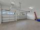 Large garage with ample space for two cars and storage at 10469 Meadowrun Dr, Lithia, FL 33547