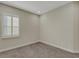 Bright bedroom with neutral walls and carpeted floor at 10469 Meadowrun Dr, Lithia, FL 33547