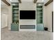 Modern fireplace with marble surround and built-in shelving at 10469 Meadowrun Dr, Lithia, FL 33547