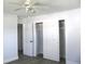 Bedroom featuring ample closet space, a ceiling fan, and fresh paint at 5260 42Nd S St, St Petersburg, FL 33711