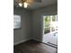 Bedroom features wood floors, white walls and a door leading out to the pool at 5260 42Nd S St, St Petersburg, FL 33711