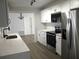 Stylish kitchen featuring stainless steel appliances and a view to the front door at 5260 42Nd S St, St Petersburg, FL 33711