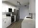 Modern kitchen features stainless steel appliances, white cabinets and light countertops at 5260 42Nd S St, St Petersburg, FL 33711