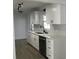 Updated kitchen features white cabinetry, stainless steel appliances, and stylish countertops at 5260 42Nd S St, St Petersburg, FL 33711